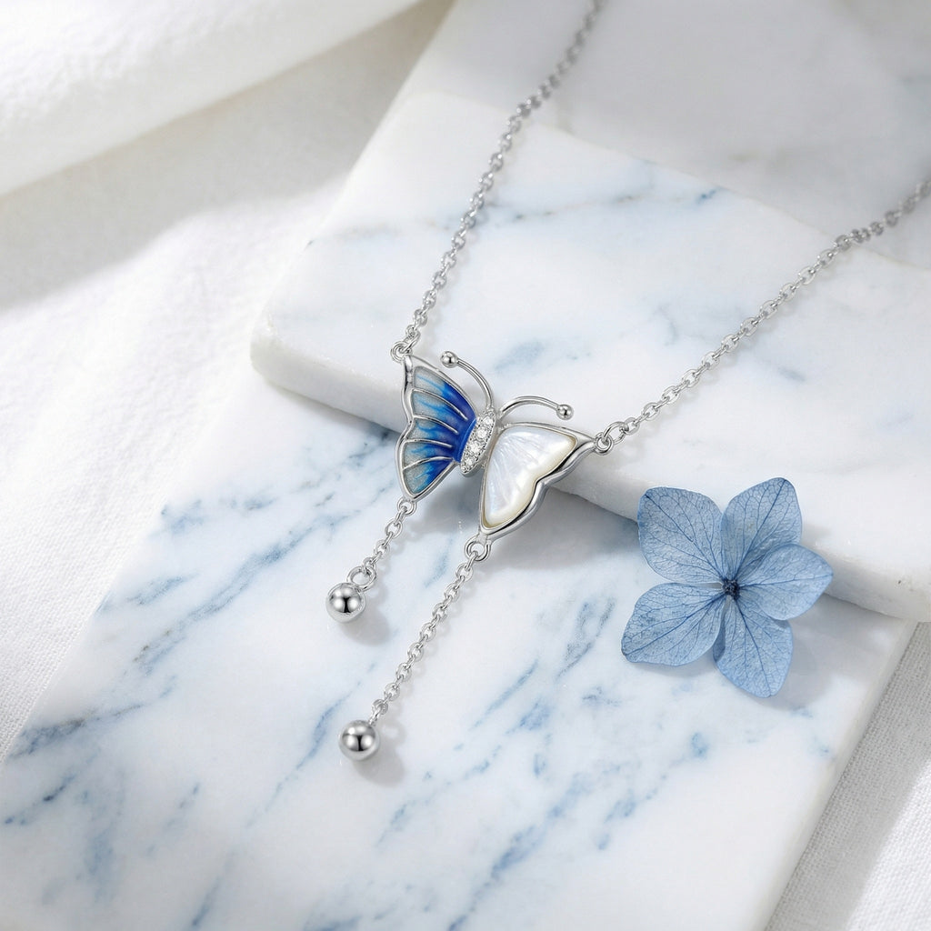 925 Sterling Silver Elegant Silver Butterfly Necklace with Blue Enamel and Mother-of-Pearl Accents